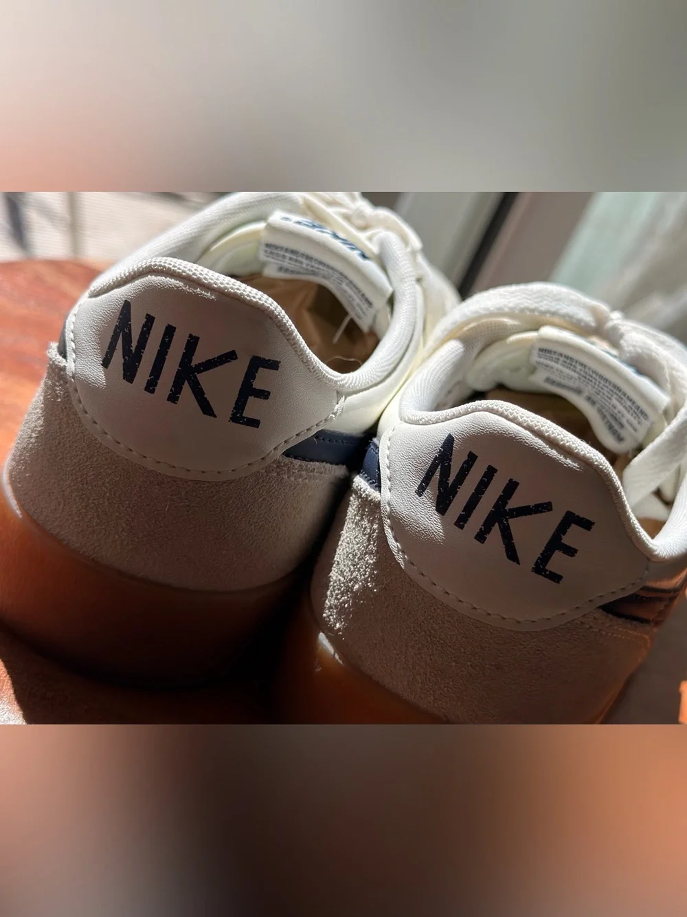 Nike Killshot 2 sneakers featuring a distinct gum rubber sole and navy swoosh 9